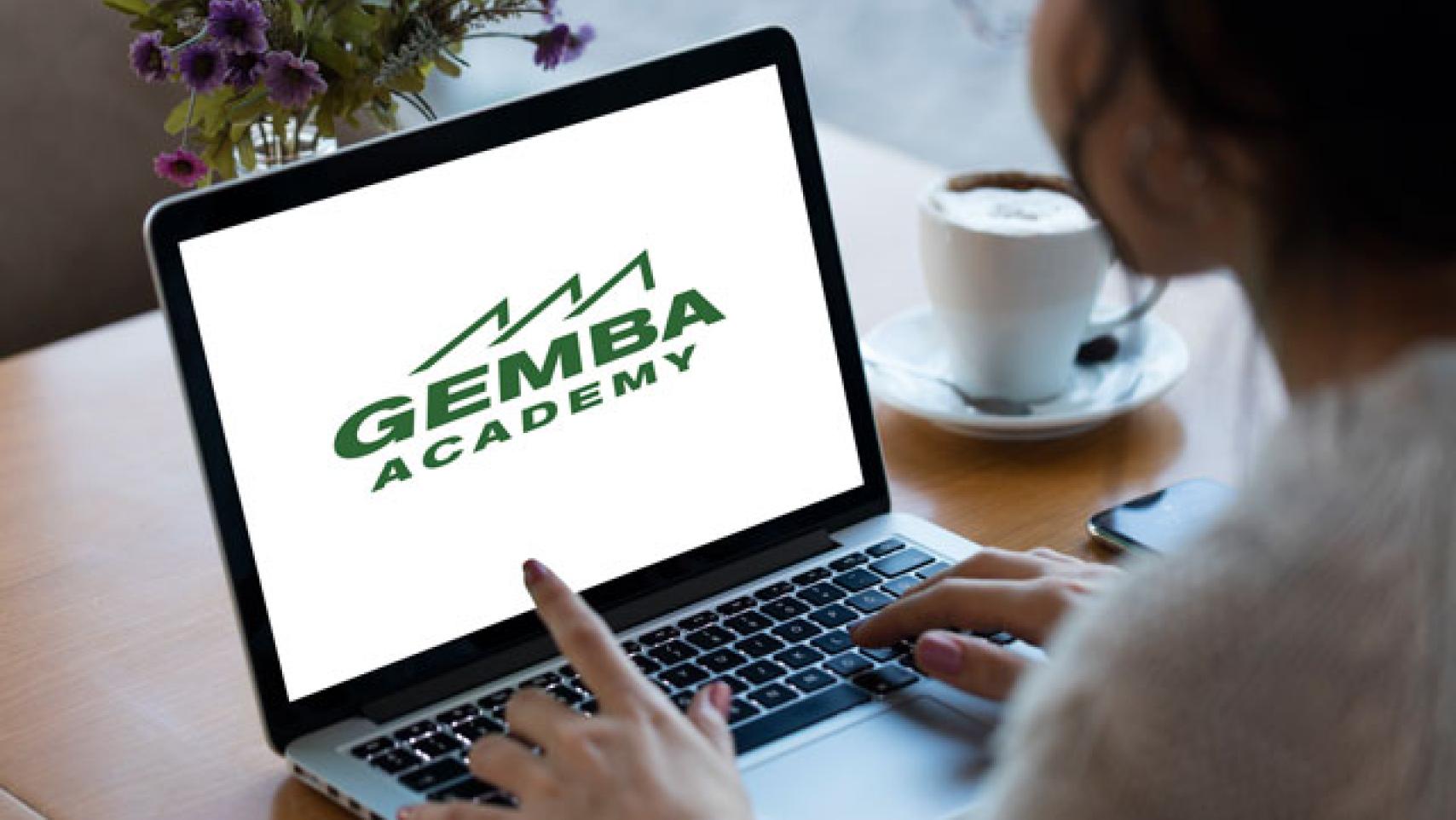 a person using gemba academy on their laptop